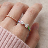 Candy Cane Ribbon Ring | White Moissanite in rose gold, worn on a model