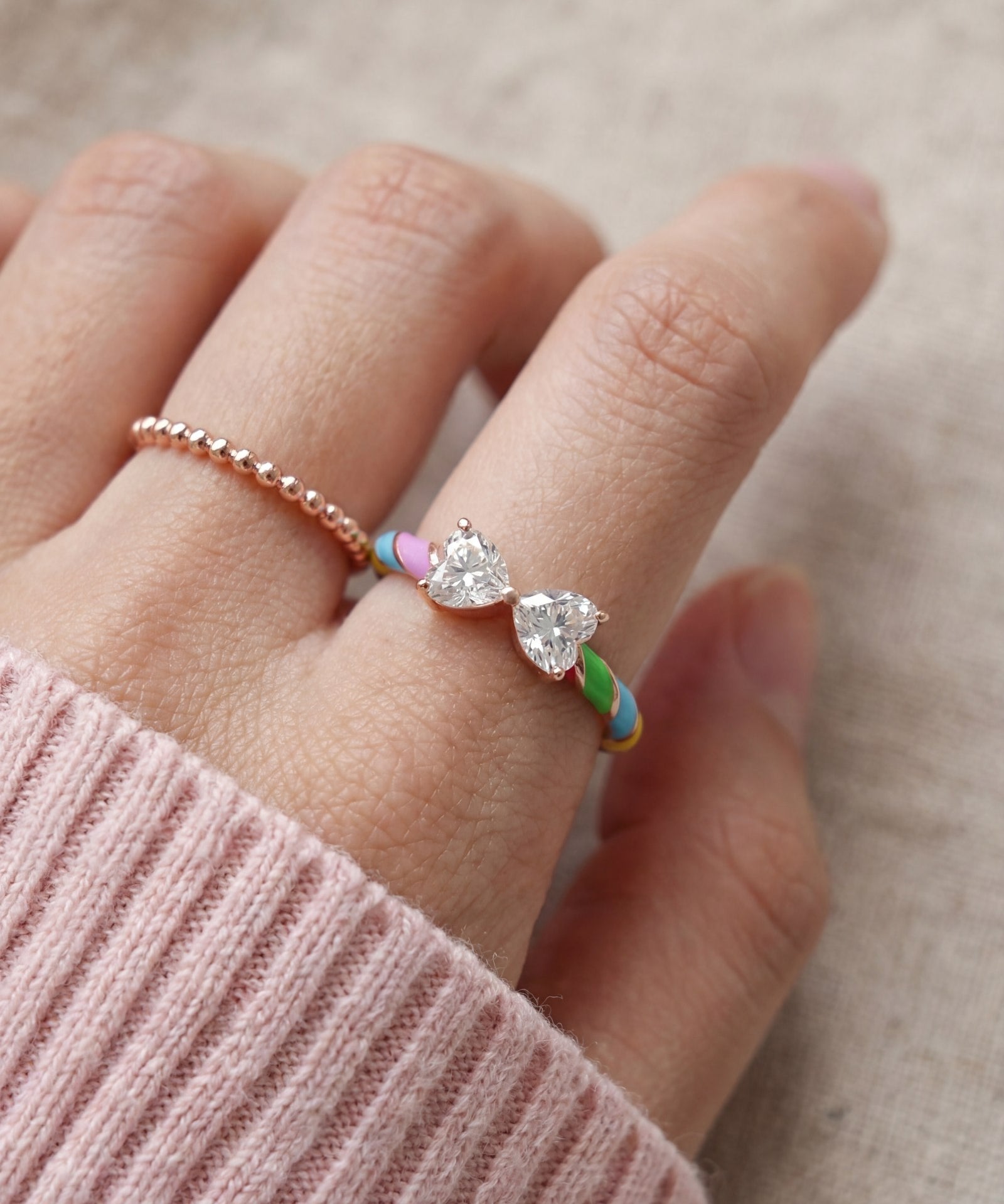 Candy Cane Ribbon Ring | White Moissanite in rose gold, worn on a model