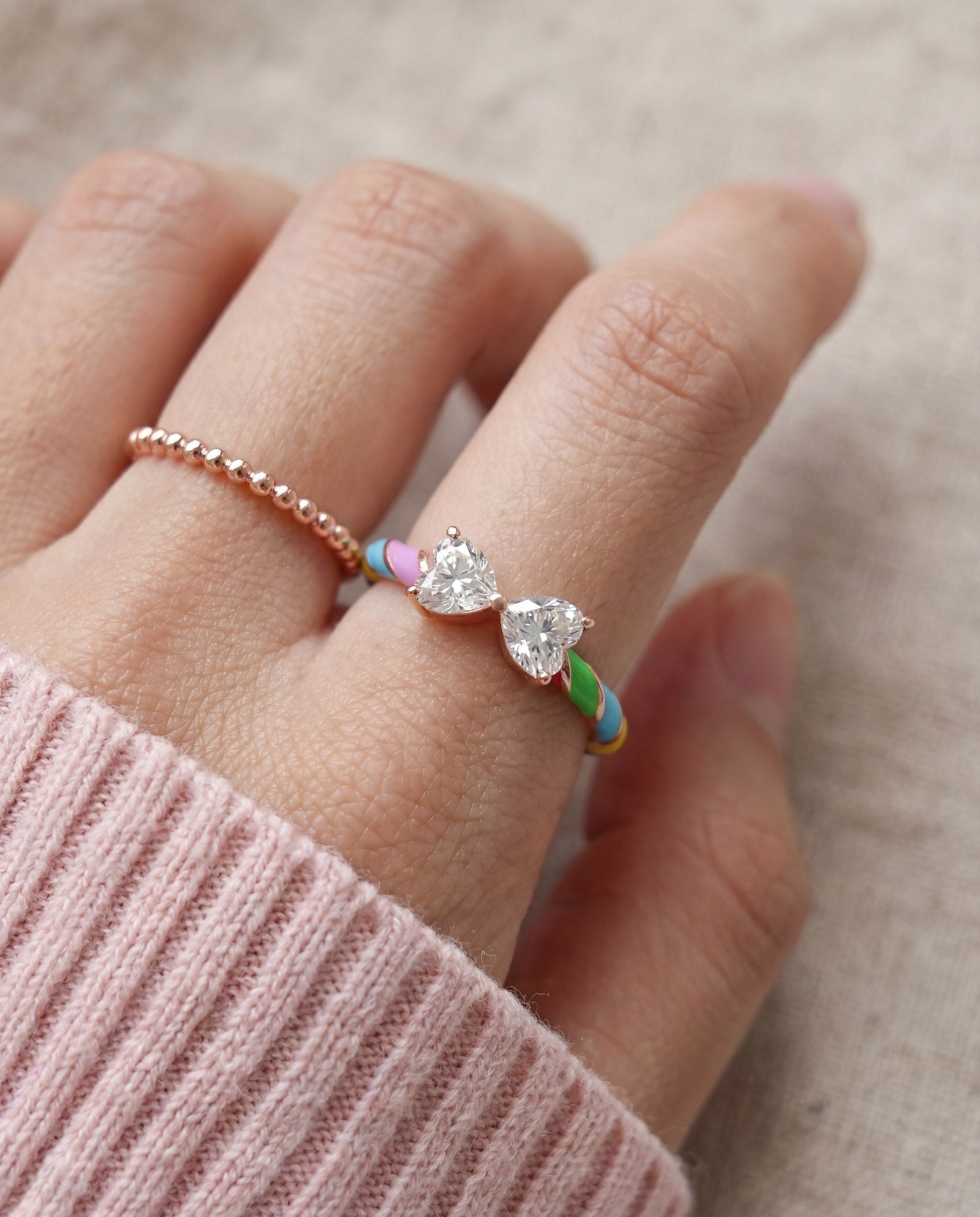 Candy Cane Ribbon Ring | White Moissanite in rose gold, worn on a model