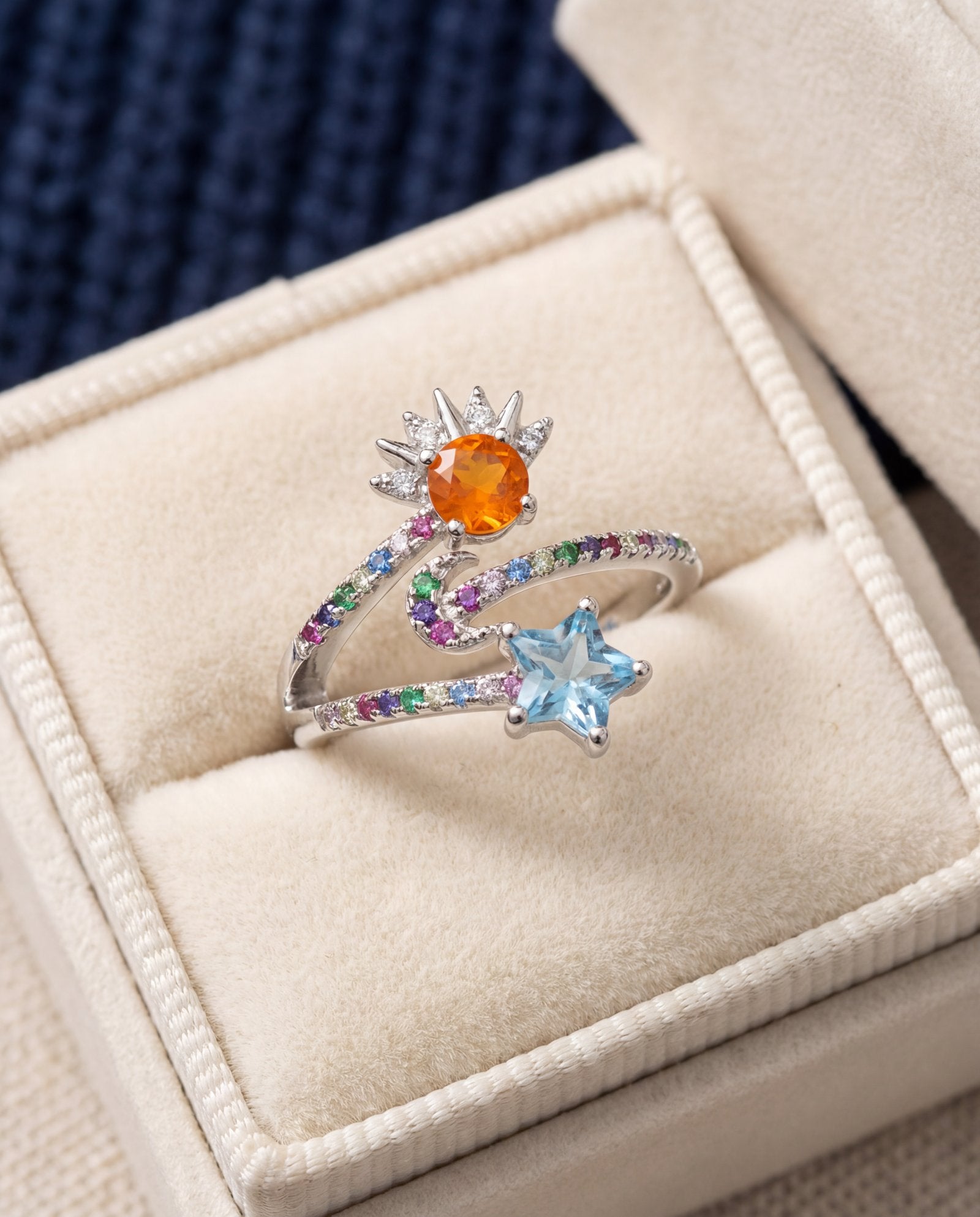 Celestial Harmony Ring | Orange Opal in silver, laid flat on a tabletop