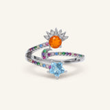 Celestial Harmony Ring | Orange Opal in silver, resting on a warm linen background