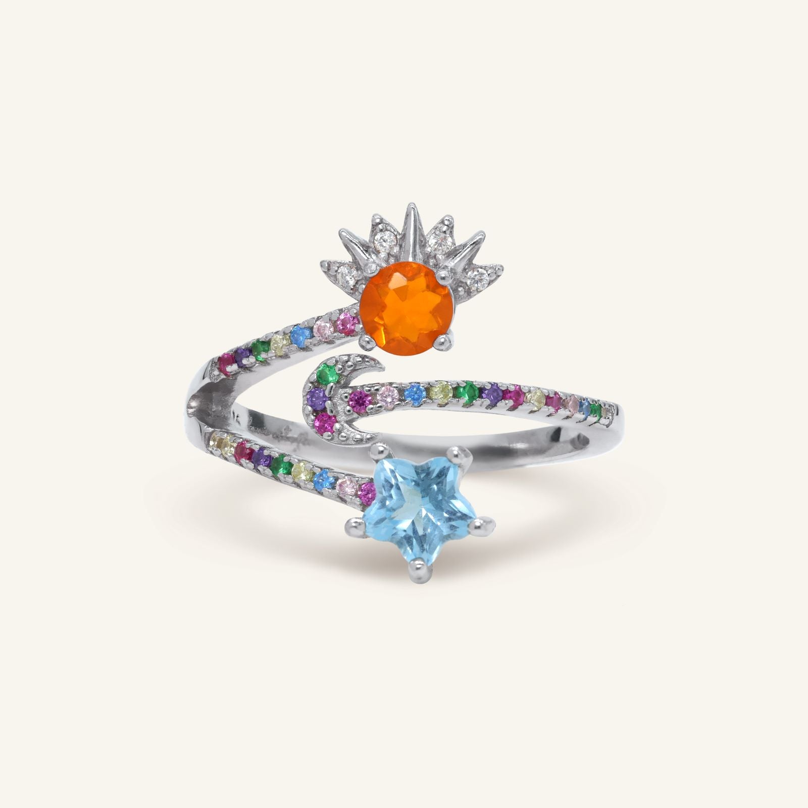 Celestial Harmony Ring | Orange Opal in silver, resting on a warm linen background