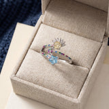 Celestial Harmony Ring | Yellow Moissanite in silver, laid flat on a tabletop