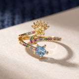 Celestial Harmony Ring | Yellow Moissanite in yellow gold, laid flat on a tabletop