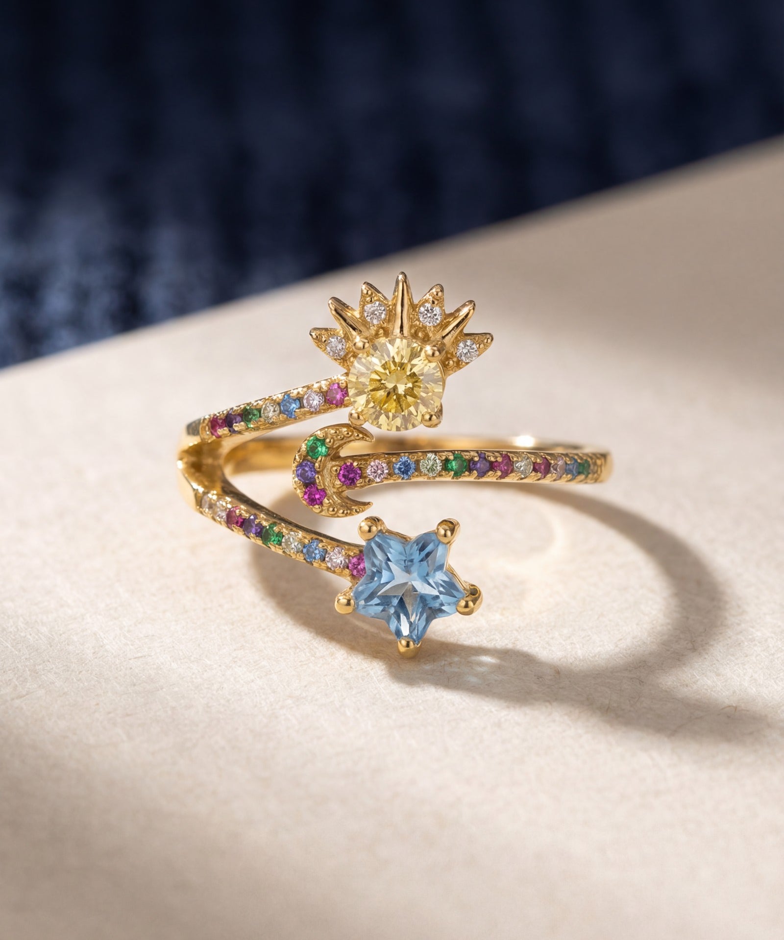 Celestial Harmony Ring | Yellow Moissanite in yellow gold, laid flat on a tabletop