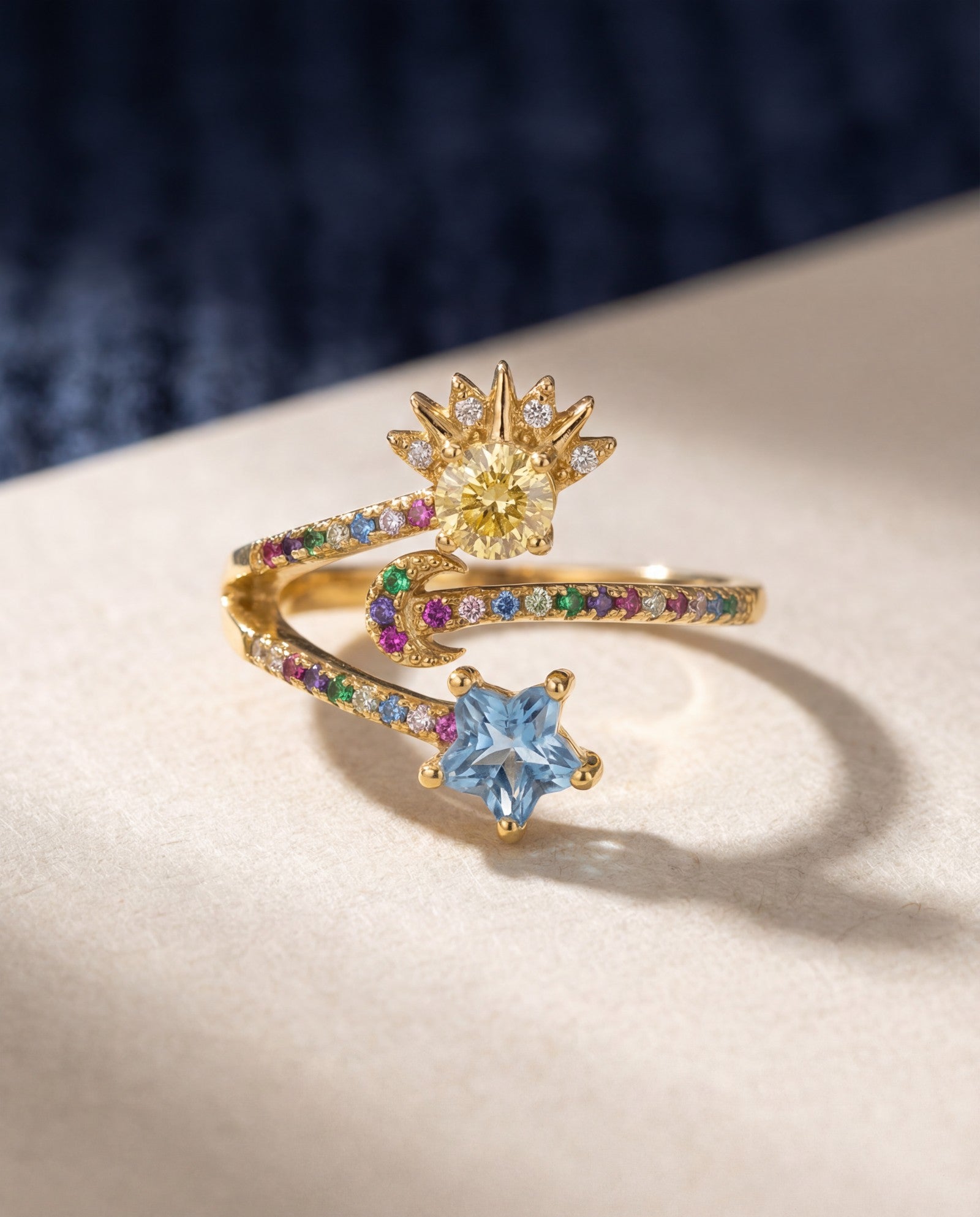 Celestial Harmony Ring | Yellow Moissanite in yellow gold, laid flat on a tabletop