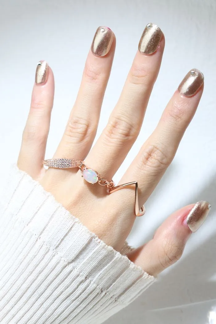 ring stack featuring opal ring, pave ring and v stacker ring