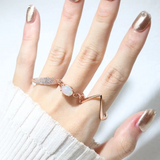 ring stack featuring opal ring, pave ring and v stacker ring