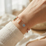 Christmas Charm Bracelet in rose gold, worn on a model