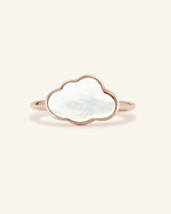 Close-up of the Cloud Mother of Pearl Ring in rose gold, resting on a warm linen background