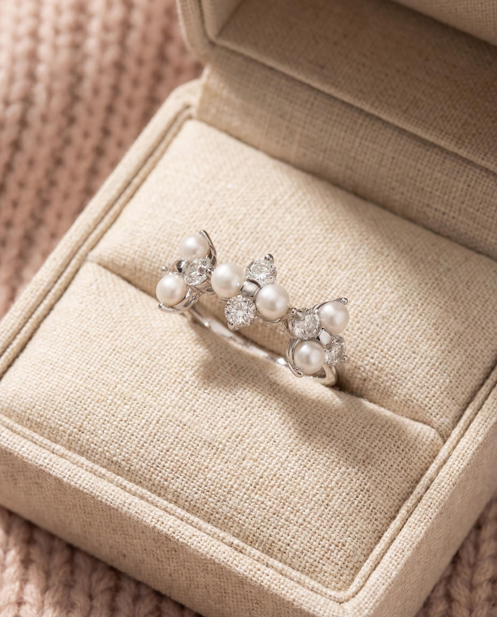 Trinity Clover Ring in silver, laid flat on a tabletop