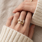 Trinity Clover Ring in yellow gold, worn on a model