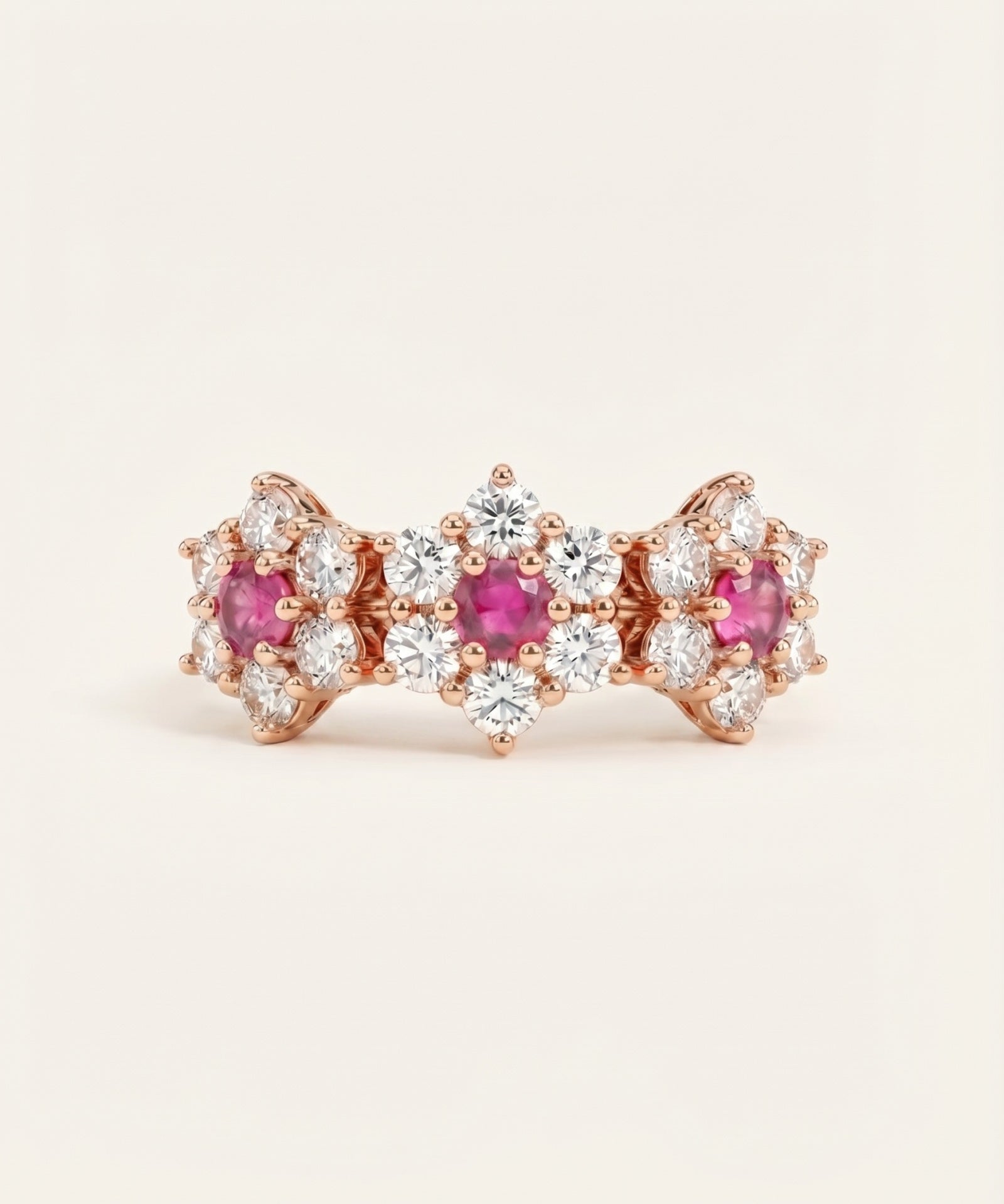 Coquette Bloom Ring featuring three natural pink sapphires in an 18k rose gold floral garland setting.
