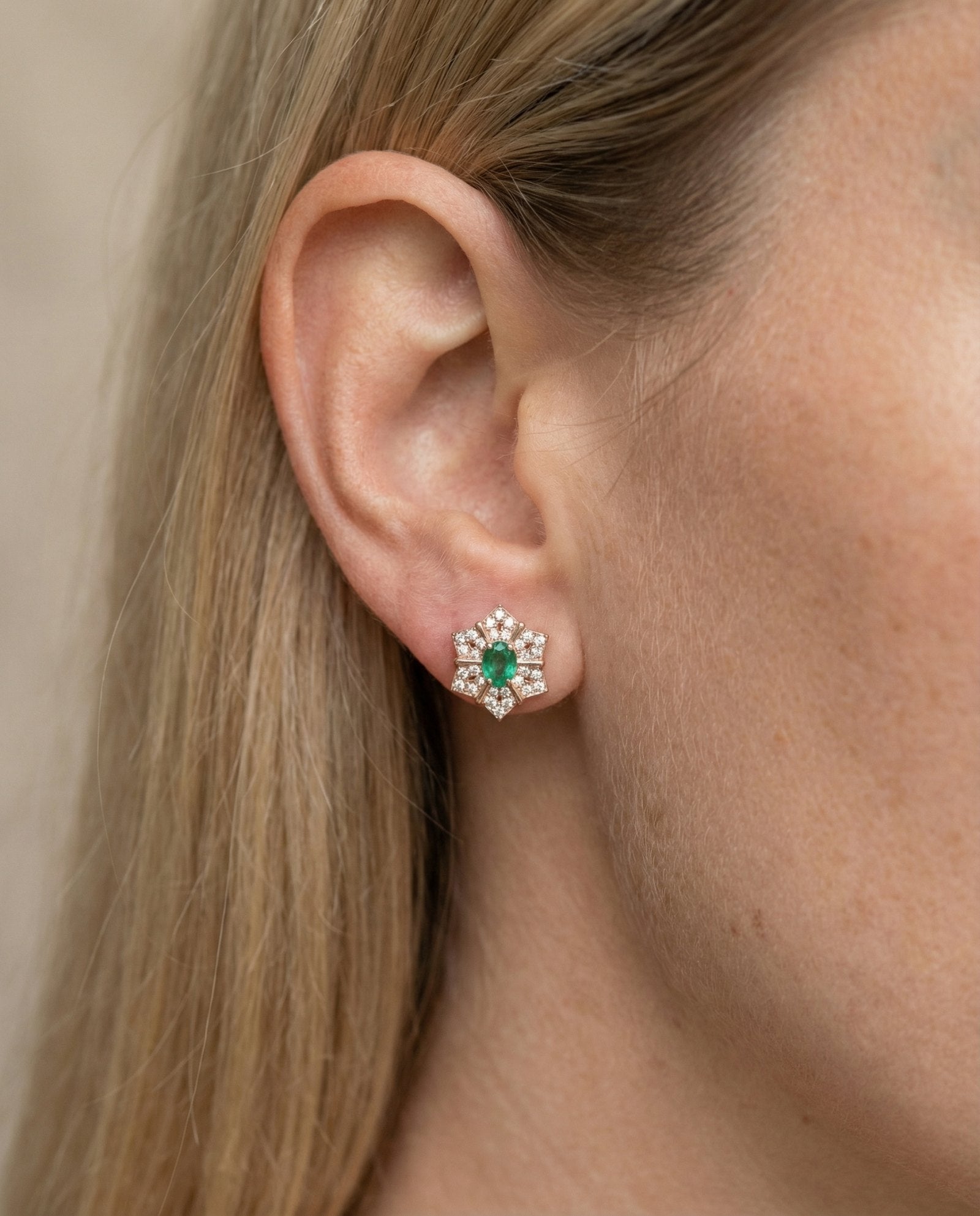 Lifestyle view of the Emerald Starflower Studs in rose gold, showing the delicate scale and sparkle on the ear.
