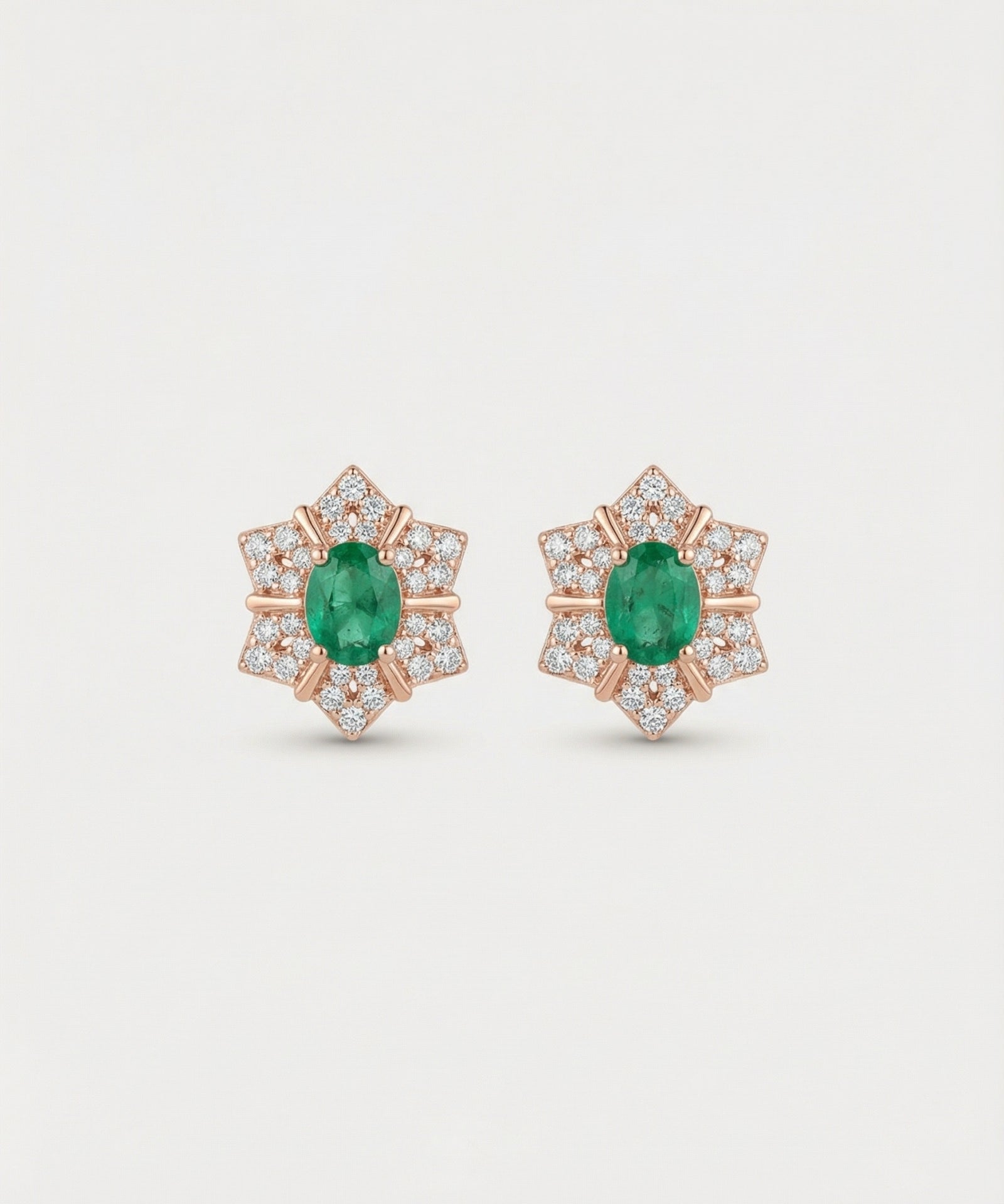Professional product shot of the Emerald Starflower Studs in 18k rose gold plating over 925 sterling silver.
