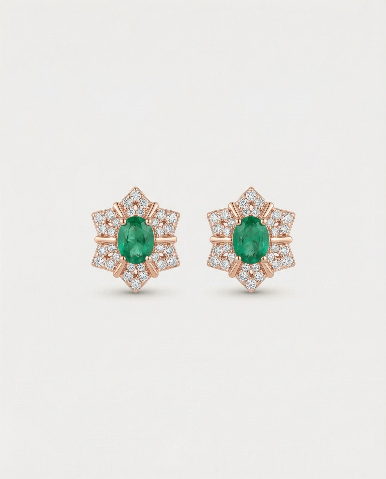 Professional product shot of the Emerald Starflower Studs in 18k rose gold plating over 925 sterling silver.