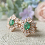 Macro photograph of the rose gold starflower earrings, showing the intricate pavé detailing and oval-cut emerald.