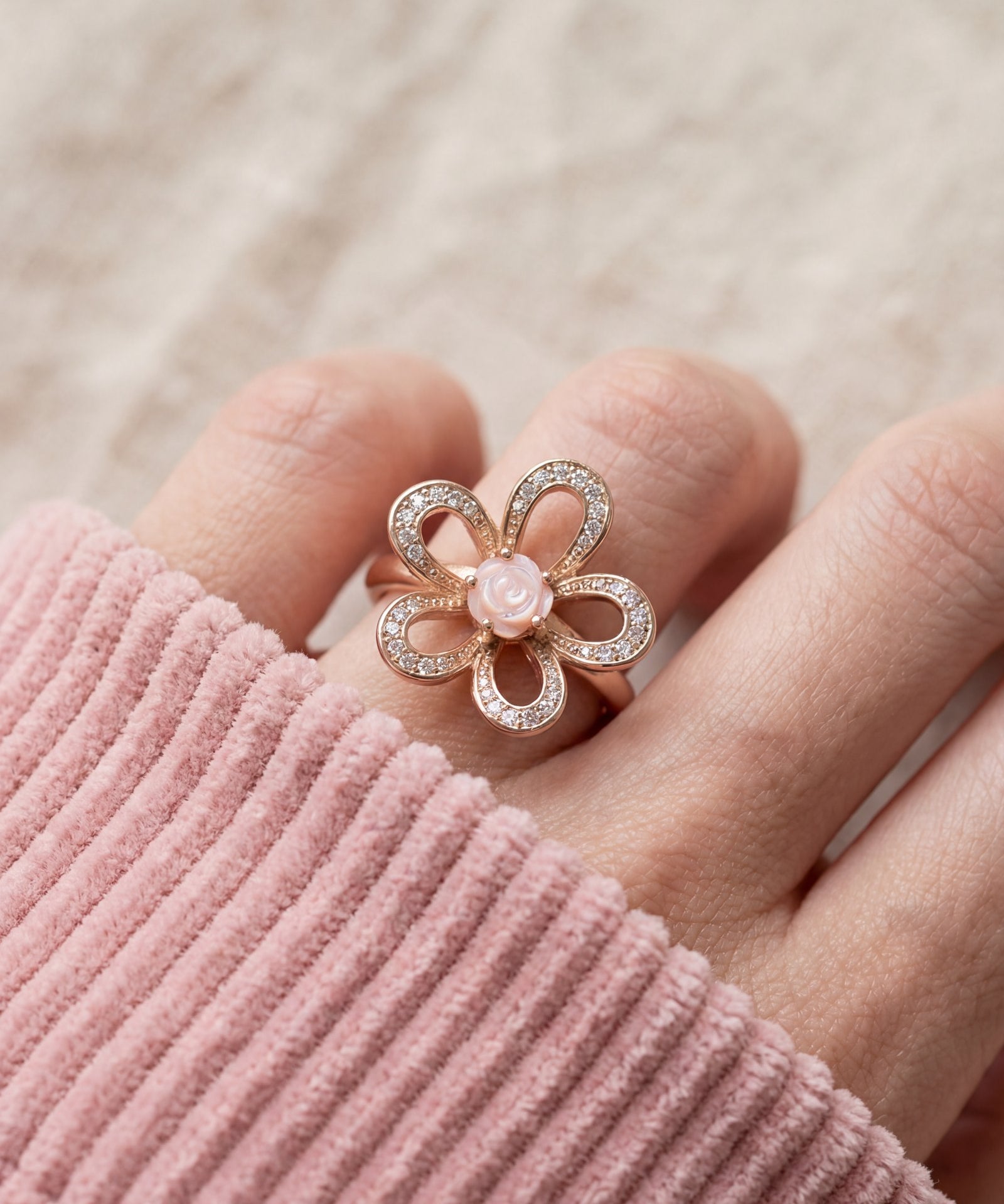 Eternal Rose Shell Ring in rose gold, worn on a model