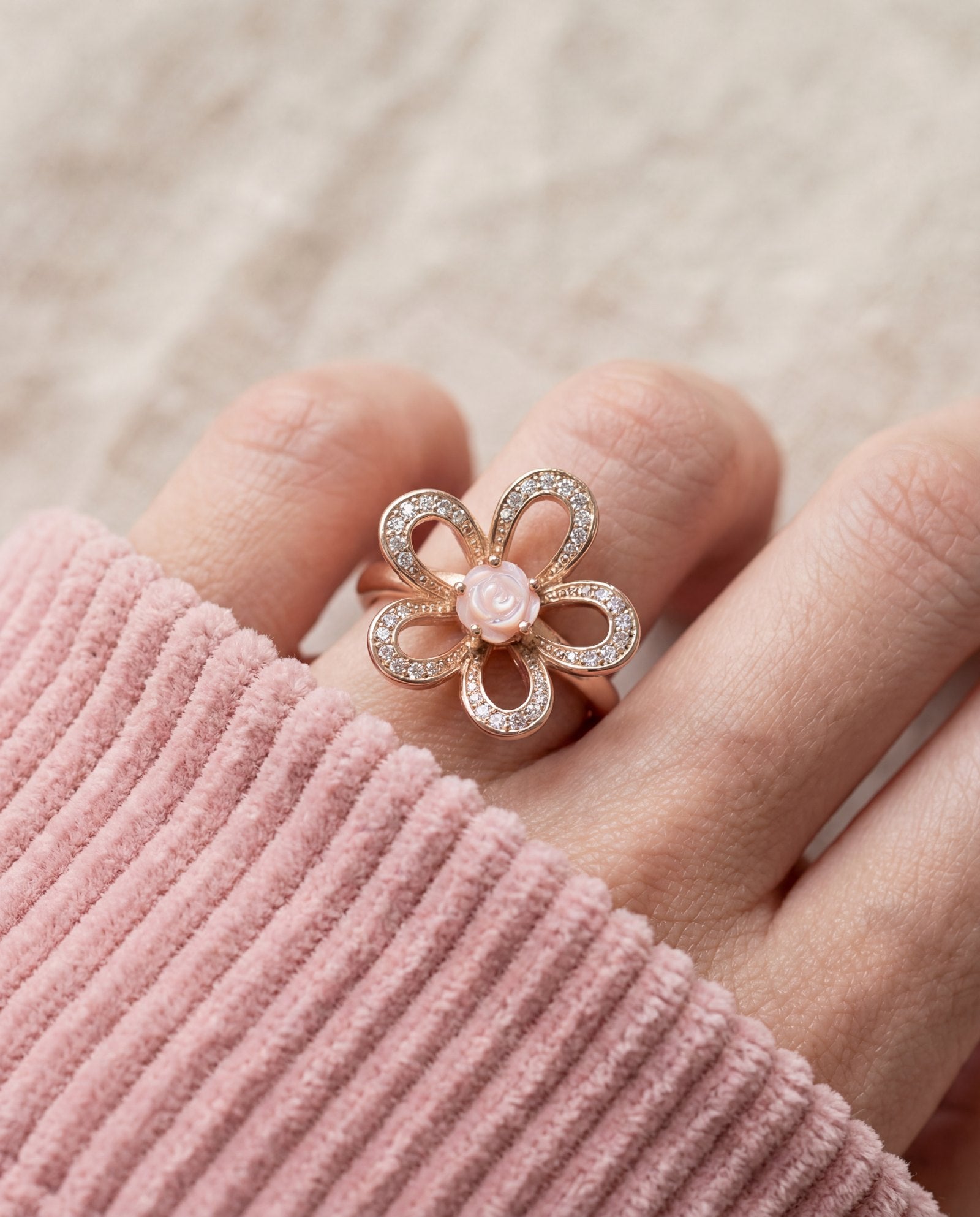 Eternal Rose Shell Ring in rose gold, worn on a model