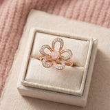 Eternal Rose Shell Ring in rose gold, laid flat on a tabletop