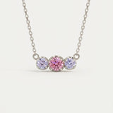 Product image of the Silver Everglow Trilogy Moissanite Necklace, featuring the graduated 'smile' design.