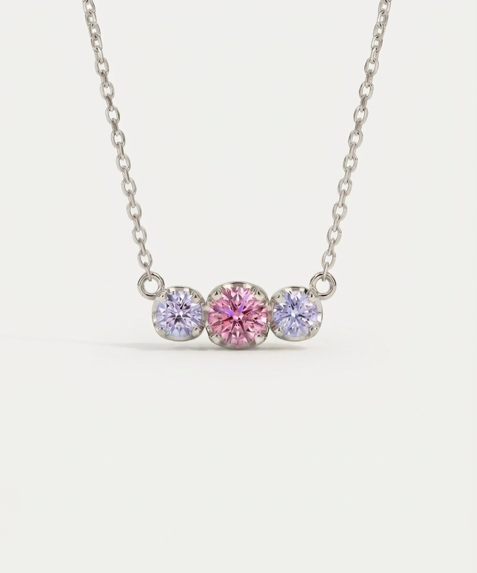 Product image of the Silver Everglow Trilogy Moissanite Necklace, featuring the graduated 'smile' design.
