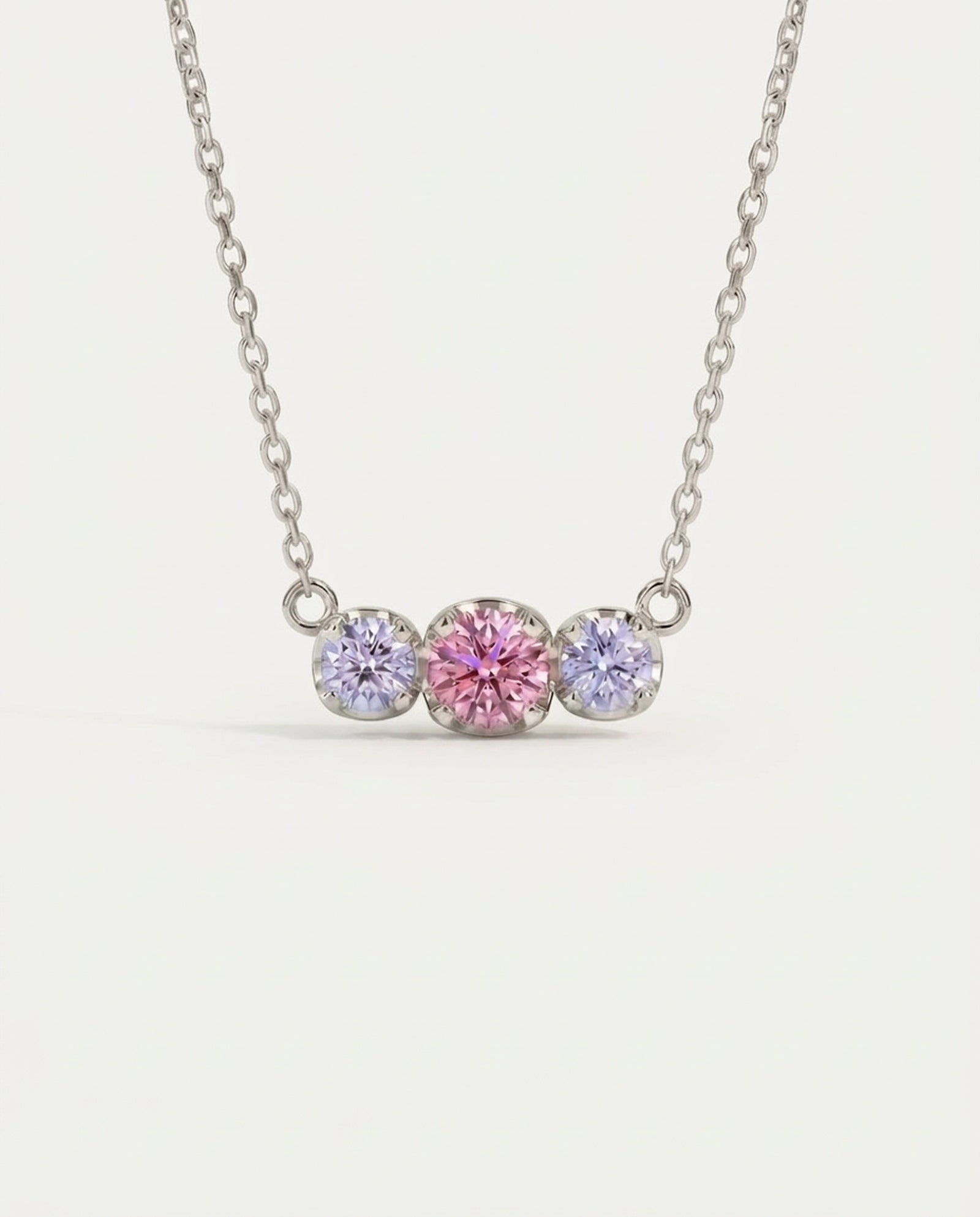 Product image of the Silver Everglow Trilogy Moissanite Necklace, featuring the graduated 'smile' design.