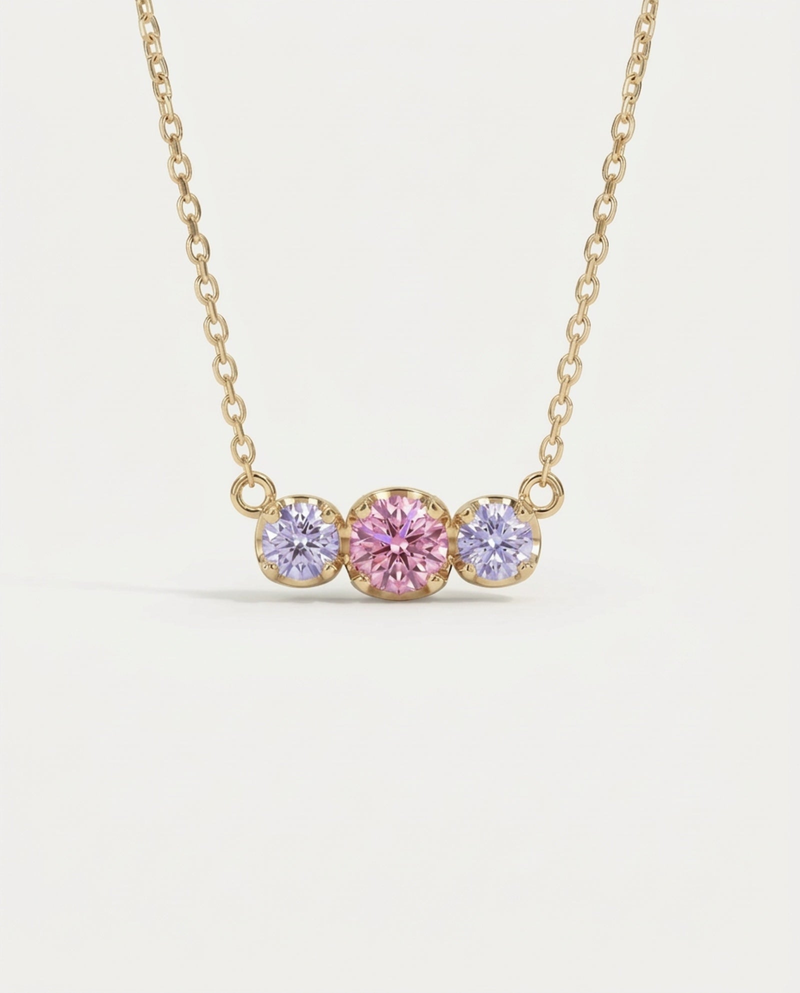Main product view of the 18k yellow gold plated Everglow Trilogy Necklace with Cotton Candy colorful moissanite.