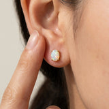 Prism Opal Studs in rose gold, worn on a model