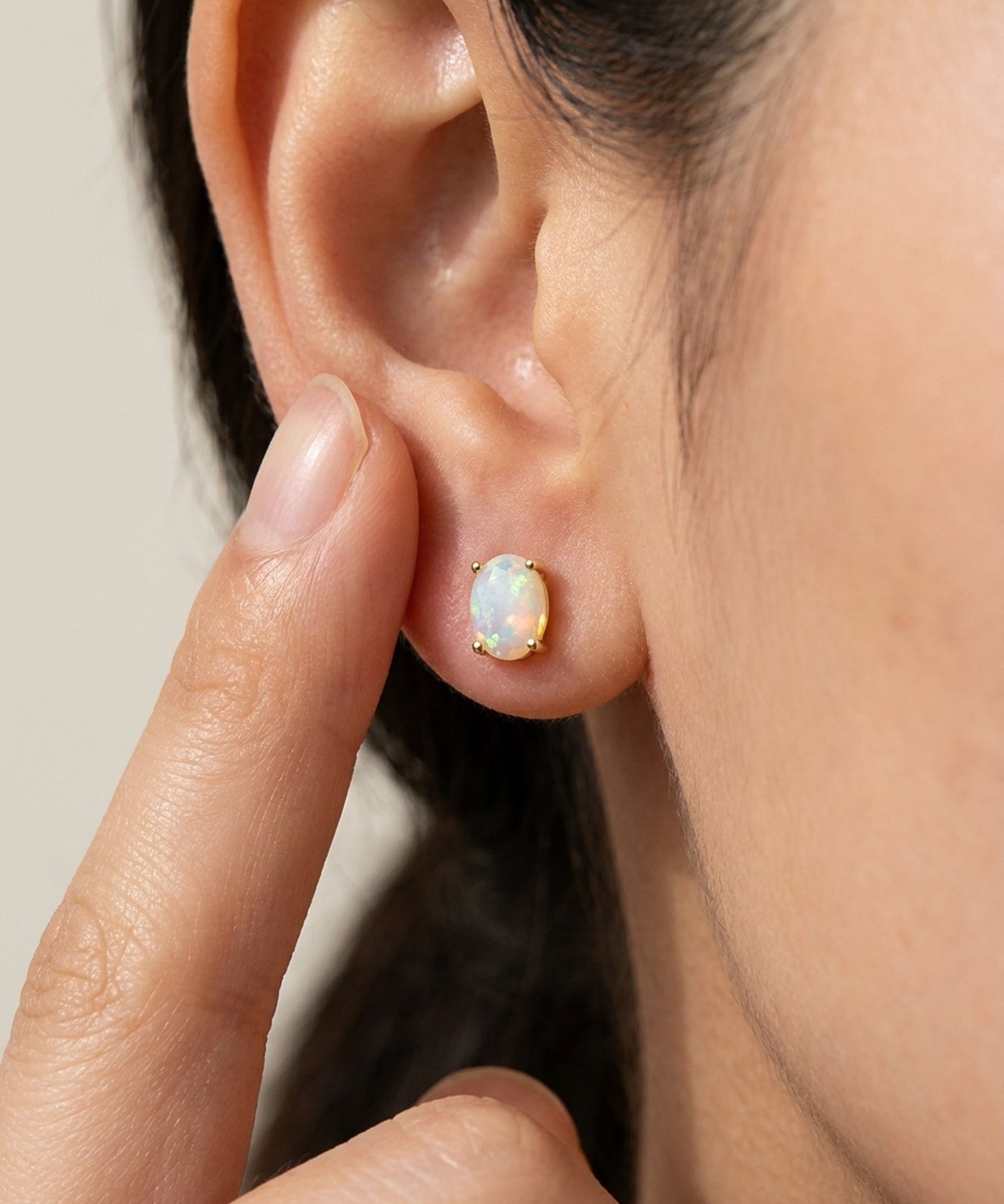 Prism Opal Studs in rose gold, worn on a model