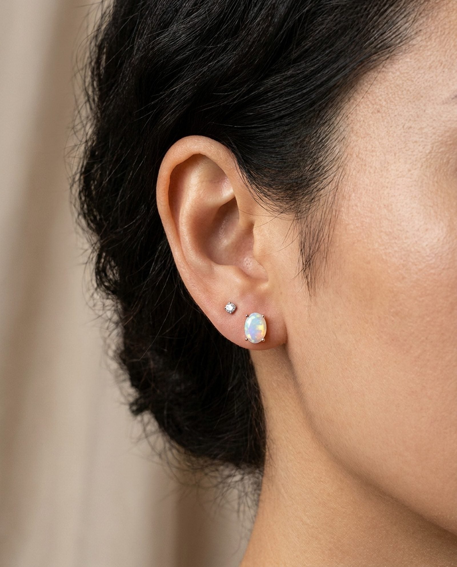 Prism Opal Studs in silver, worn on a model