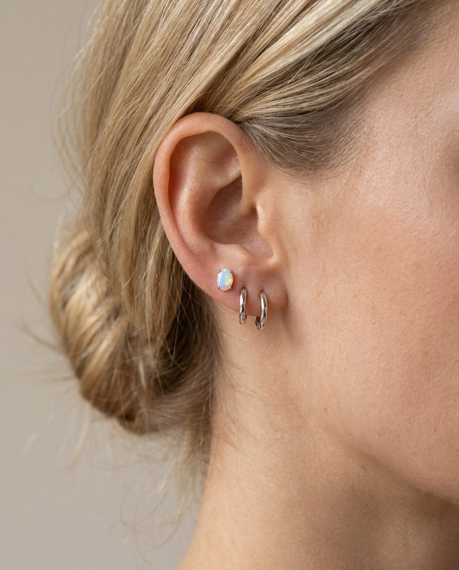 Prism Opal Studs in silver, worn on a model, alternate angle