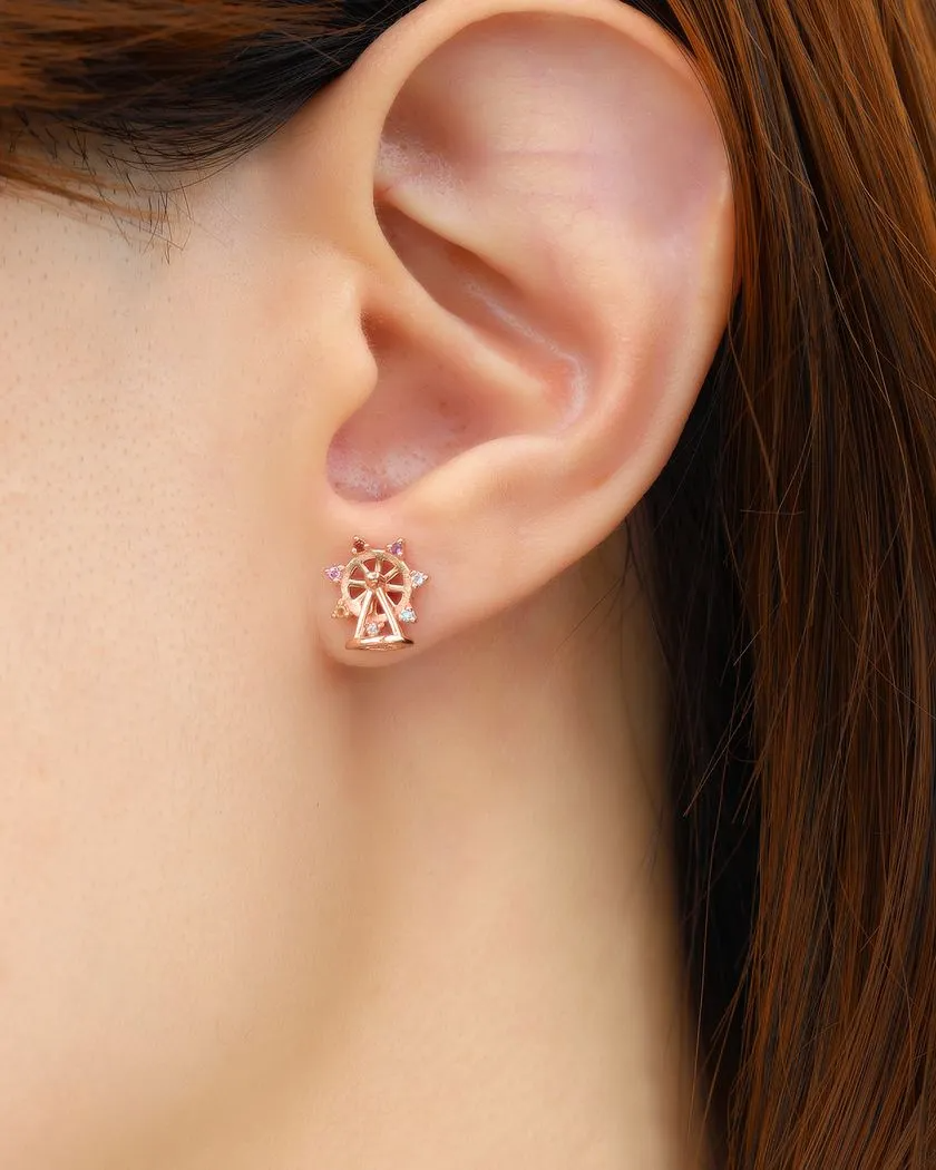 model wearing rose gold petite spinning ferris wheel studs in semi precious stones and moissanite