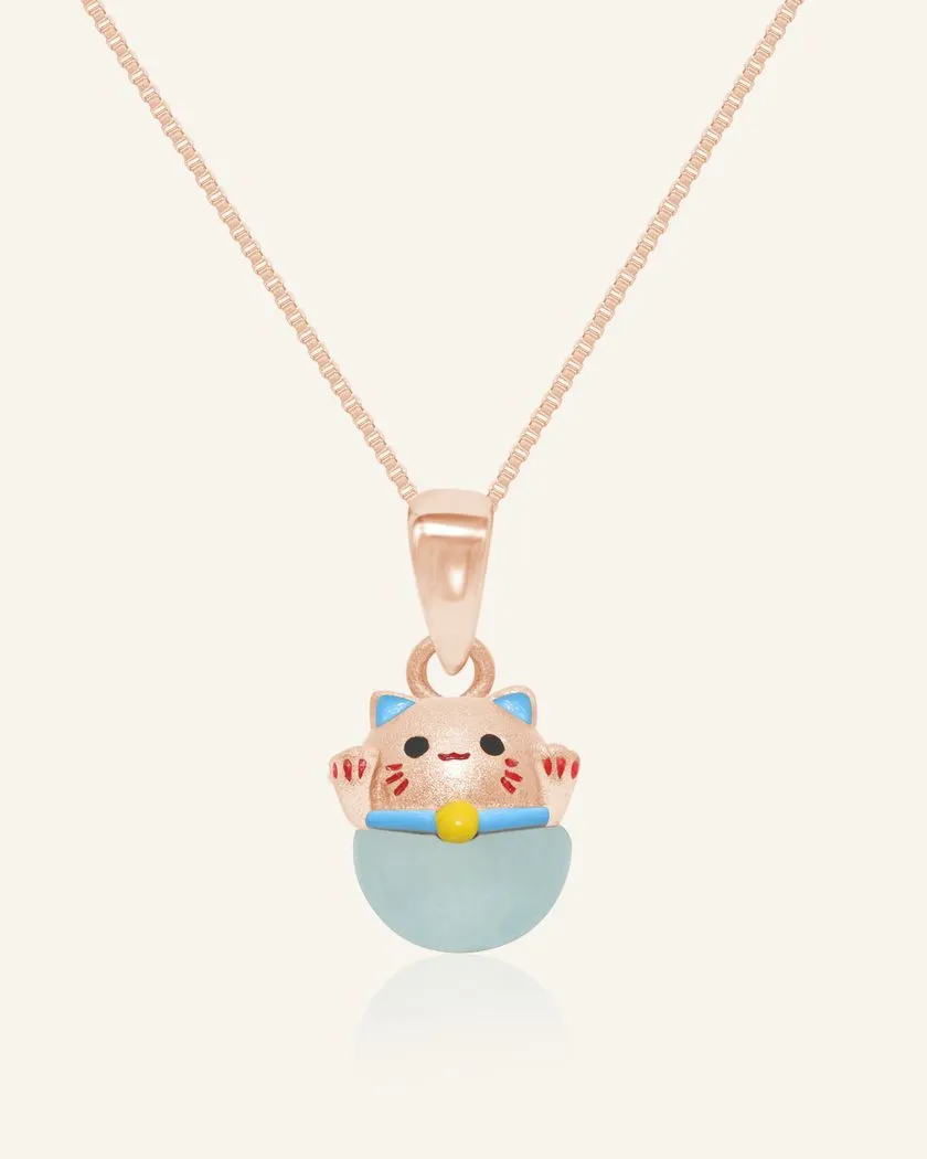 Fortune cat necklace featuring a rose gold pendant with a cheerful hand-painted cat perched atop a smooth blue chalcedony gemstone, symbolizing serenity and good fortune.