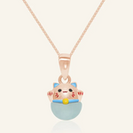 Fortune cat necklace featuring a rose gold pendant with a cheerful hand-painted cat perched atop a smooth blue chalcedony gemstone, symbolizing serenity and good fortune.