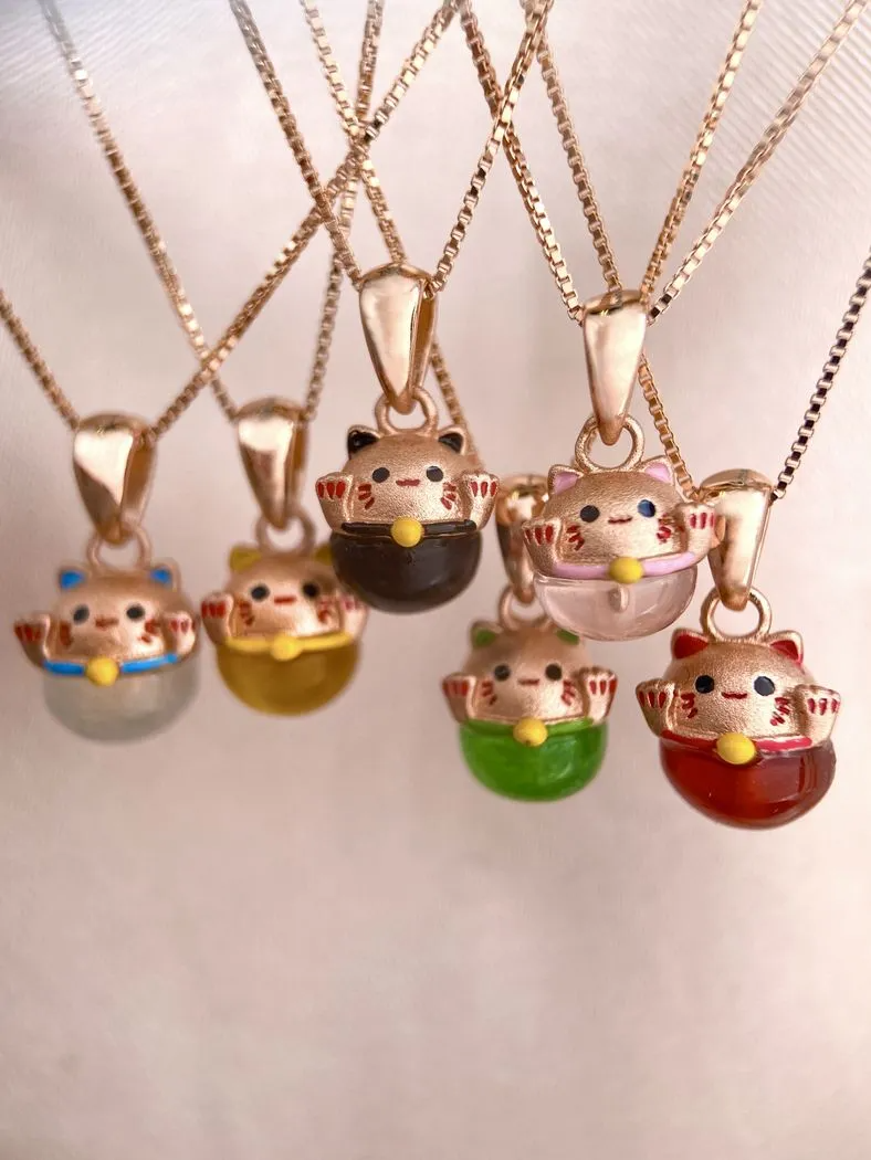 A collection of Fortune Cat Necklaces.
