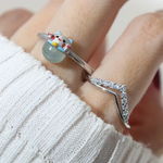 A model wearing the whimsical Fortune Cat ring crafted in silver, featuring a vibrant blue chalcedony gemstone. The adorable Maneki-neko design symbolizes luck and positivity, perfect for adding charm to any outfit.