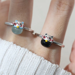 A model wearing the whimsical Fortune Cat ring crafted in silver, featuring a vibrant blue chalcedony gemstone. The adorable Maneki-neko design symbolizes luck and positivity, perfect for adding charm to any outfit.