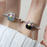 A model wearing the whimsical Fortune Cat ring crafted in silver, featuring a vibrant blue chalcedony gemstone. The adorable Maneki-neko design symbolizes luck and positivity, perfect for adding charm to any outfit.