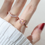 A model wearing the Fortune cat ring crafted in rose gold, featuring a playful cat motif resting on a polished rose quartz gemstone, symbolizing luck and positivity.