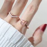 A model wearing the Fortune cat ring crafted in rose gold, featuring a playful cat motif resting on a polished rose quartz gemstone, symbolizing luck and positivity.