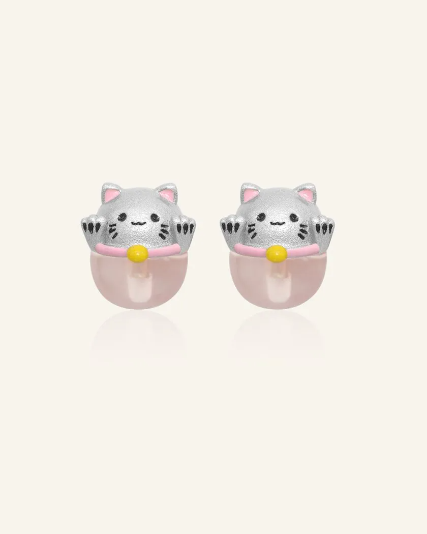 Silver fortune cat-inspired studs featuring adorable feline motifs perched on delicate rose quartz gemstones, symbolizing love and positivity.