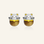 Silver fortune cat-inspired studs featuring adorable feline motifs, elegantly perched on polished tiger eye gemstones for a touch of charm and good fortune.