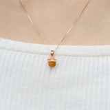 Fortune Cat Necklace (Tiger Eye) in rose gold, worn on a model