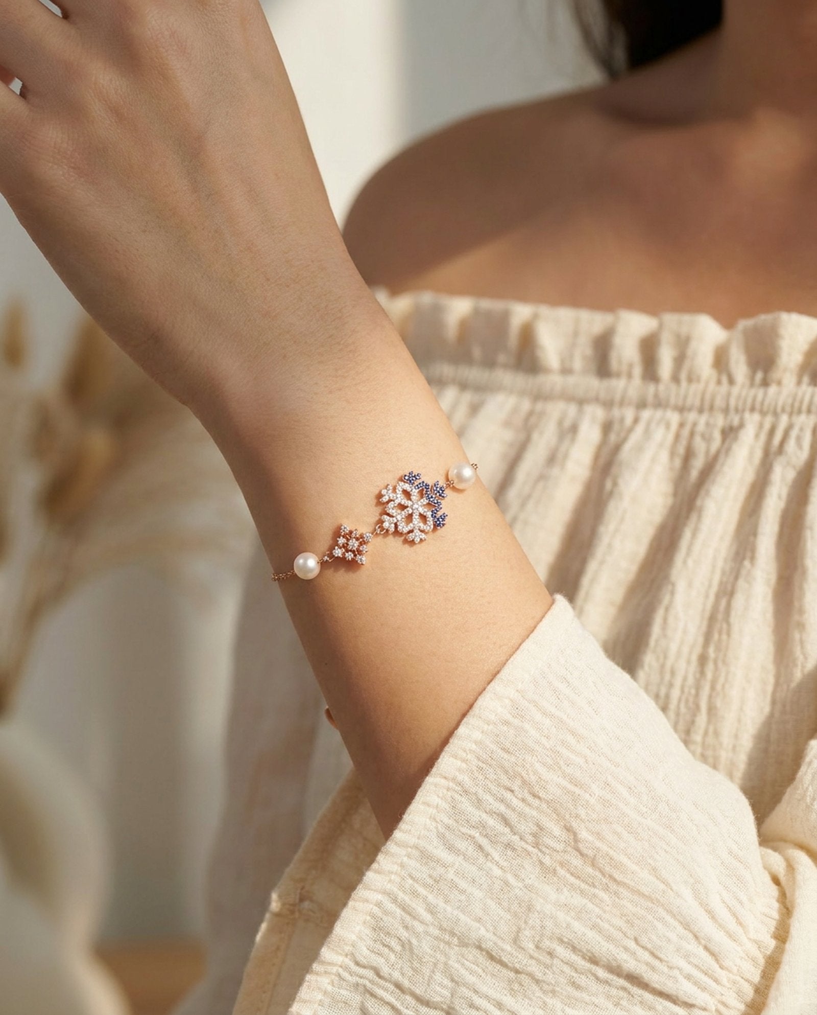 Frosted Snowflake Pearl Bracelet in rose gold, worn on a model