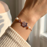 Frosted Snowflake Pearl Bracelet in rose gold, worn on a model