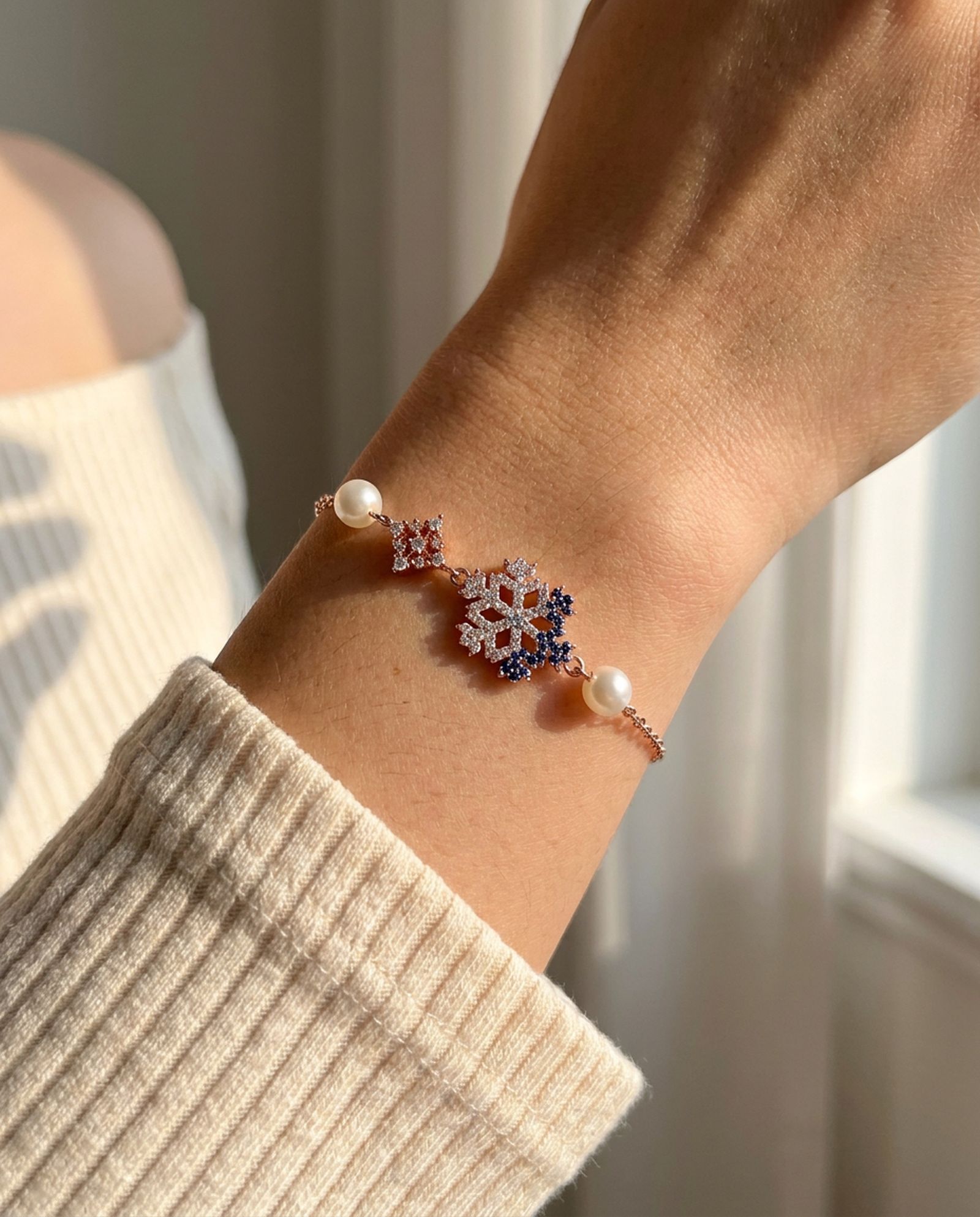 Frosted Snowflake Pearl Bracelet in rose gold, worn on a model