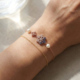 Frosted Snowflake Pearl Bracelet in rose gold, worn on a model
