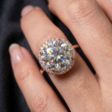 Close-up view of Grand Halo Ring in Rose Gold on hand, showcasing the fire and brilliance of the 3-carat center stone.