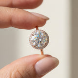 Side angle of the Grand Halo Ring in Rose Gold, demonstrating the classic raised setting and substantial 9mm moissanite depth.
